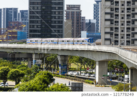 View of a Taoyuan International Airport line train running on the elevated track of the Taoyuan Mass Rapid Transit System. 121778249