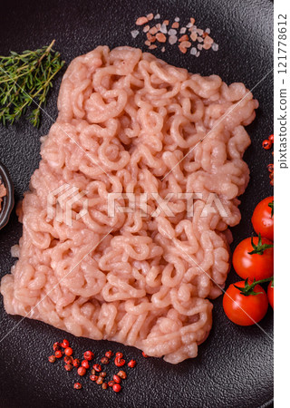 Fresh raw chicken mince with salt, spices and herbs 121778612