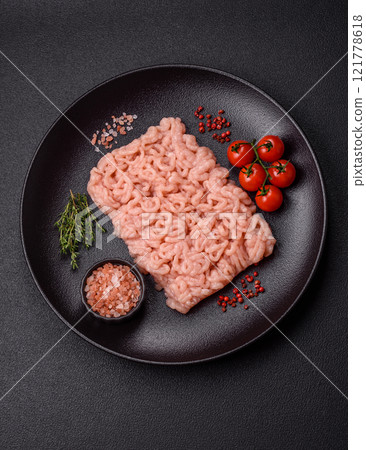 Fresh raw chicken mince with salt, spices and herbs 121778618