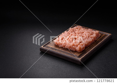 Fresh raw chicken mince with salt, spices and herbs 121778621