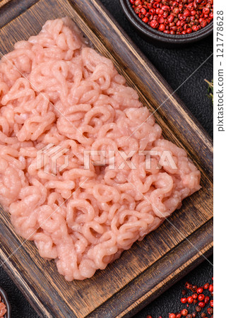 Fresh raw chicken mince with salt, spices and herbs 121778628