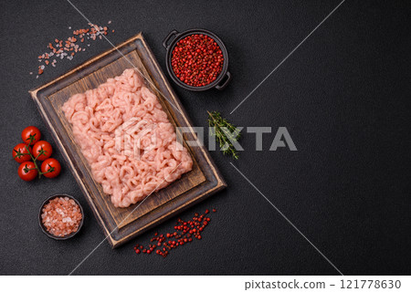 Fresh raw chicken mince with salt, spices and herbs Fresh raw chicken mince with salt, spices and herbs 121778630