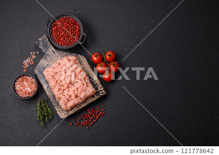 Fresh raw chicken mince with salt, spices and herbs Fresh raw chicken mince with salt, spices and herbs 121778642