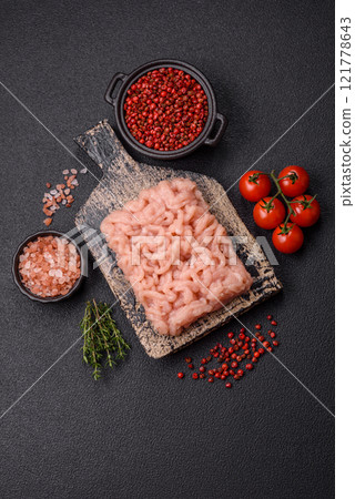 Fresh raw chicken mince with salt, spices and herbs Fresh raw chicken mince with salt, spices and herbs 121778643