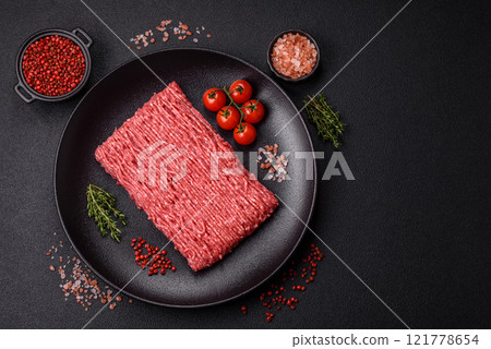 Fresh raw ground beef with salt, spices and herbs 121778654