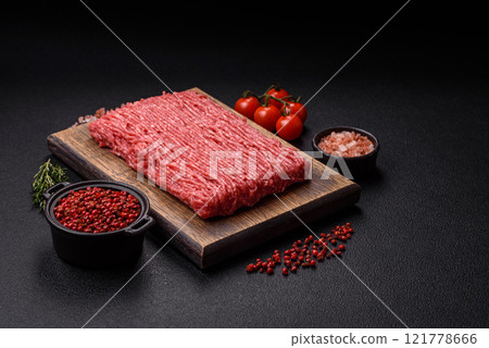 Fresh raw ground beef with salt, spices and herbs Fresh raw ground beef with salt, spices and herbs 121778666