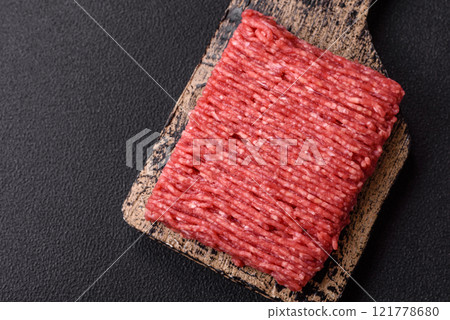 Fresh raw ground beef with salt, spices and herbs 121778680
