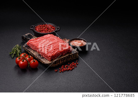 Fresh raw ground beef with salt, spices and herbs 121778685