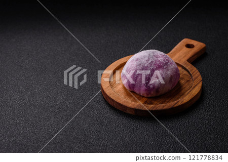 Delicious colorful asian mochi sweets with rice dough shell and fruit filling 121778834