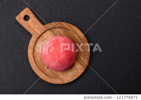 Delicious colorful asian mochi sweets with rice dough shell and fruit filling 121778871
