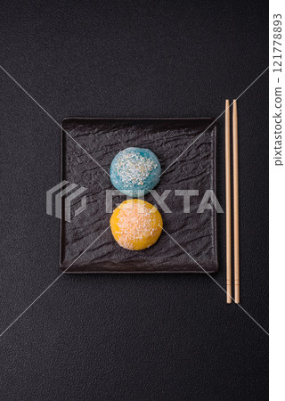 Delicious colorful asian mochi sweets with rice dough shell and fruit filling 121778893