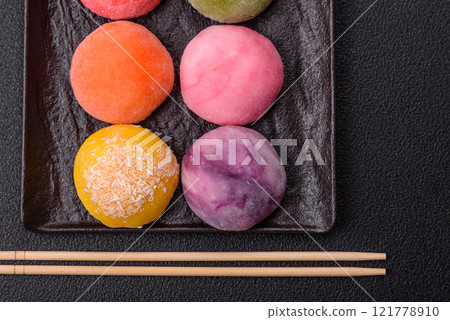 Delicious colorful asian mochi sweets with rice dough shell and fruit filling 121778910