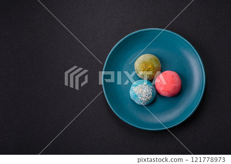 Delicious colorful asian mochi sweets with rice dough shell and fruit filling 121778973