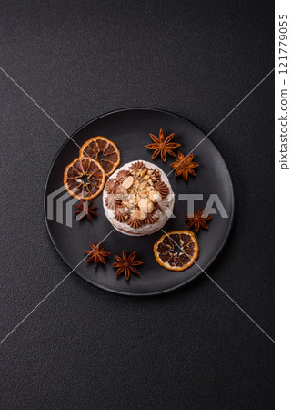 Sweet puff tart with meringue, cream and nuts 121779055