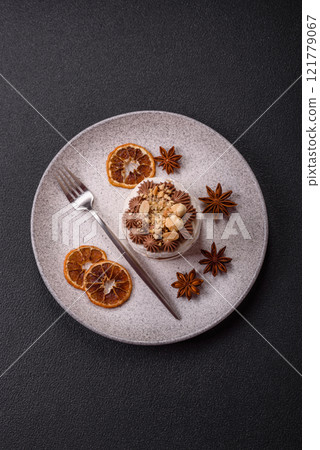 Sweet puff tart with meringue, cream and nuts 121779067