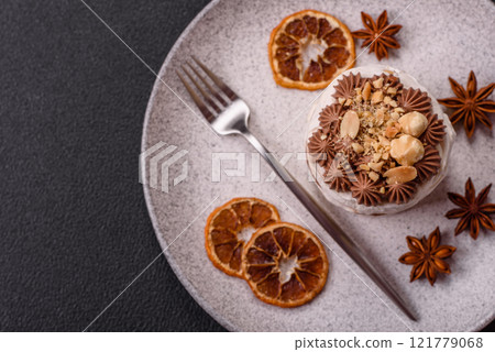 Sweet puff tart with meringue, cream and nuts 121779068