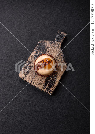 Sweet tart with pear lemon mousse cream and chocolate cake base 121779079