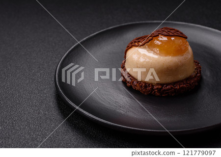 Sweet tart with pear lemon mousse cream and chocolate cake base 121779097