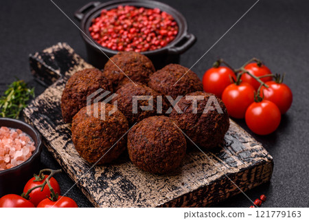 Falafel vegetarian and vegan dish made with chickpeas, spices and herbs Falafel vegetarian and vegan dish made with chickpeas, spices and herbs 121779163