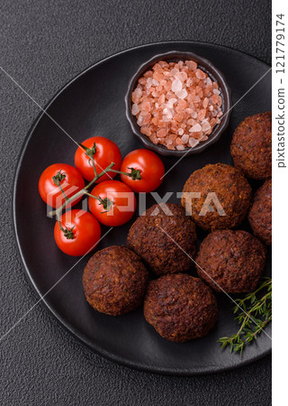 Falafel vegetarian and vegan dish made with chickpeas, spices and herbs Falafel vegetarian and vegan dish made with chickpeas, spices and herbs 121779174