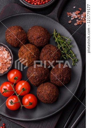 Falafel vegetarian and vegan dish made with chickpeas, spices and herbs Falafel vegetarian and vegan dish made with chickpeas, spices and herbs 121779177
