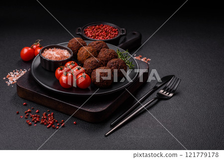 Falafel vegetarian and vegan dish made with chickpeas, spices and herbs Falafel vegetarian and vegan dish made with chickpeas, spices and herbs 121779178