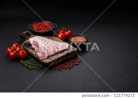 Fresh raw bacon sliced with spices and herbs Fresh raw bacon sliced with spices and herbs 121779213