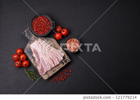 Fresh raw bacon sliced with spices and herbs Fresh raw bacon sliced with spices and herbs 121779214