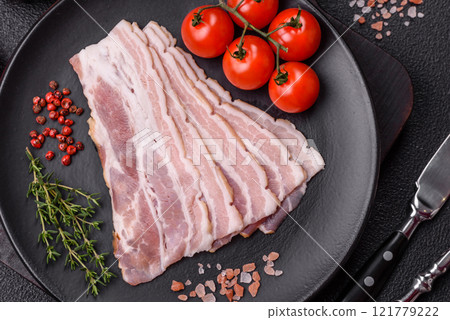 Fresh raw bacon sliced with spices and herbs 121779222