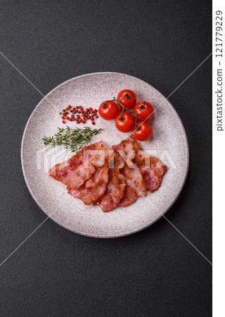 Delicious crispy bacon grilled with salt and spices 121779229