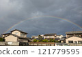 A rainbow over the town after the rain 121779595