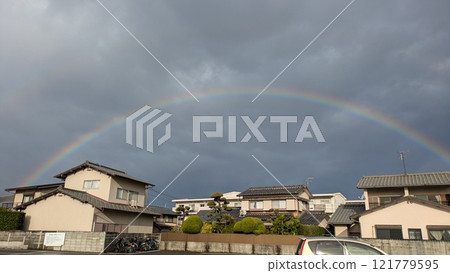 A rainbow over the town after the rain 121779595
