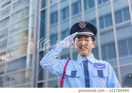 A middle-aged male security guard saluting. Photo courtesy of Denpa Gakuen, Tokyo Electronics College. A middle-aged male security guard saluting. Photo courtesy of Denpa Gakuen, Tokyo Electronics College. 121780494