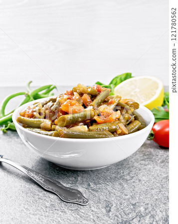 Beans green with vegetables in bowl on granite 121780562
