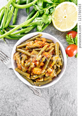 Beans green with vegetables in bowl on granite top Beans green with vegetables in bowl on granite top 121780563