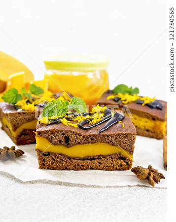 Cake chocolate with pumpkin layer on granite Cake chocolate with pumpkin layer on granite 121780566