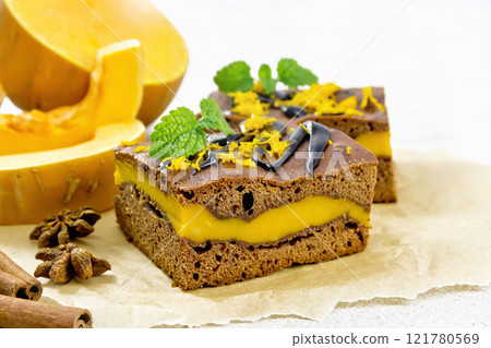 Cake chocolate with pumpkin layer on light granite 121780569