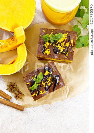 Cake chocolate with pumpkin layer on paper top 121780570
