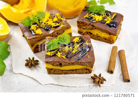 Cake chocolate with pumpkin layer on stone countertop 121780571