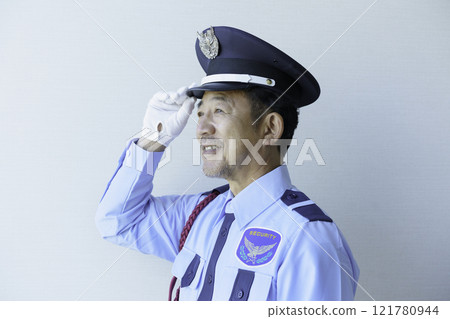 Profile of a middle-aged male security guard against a white background. Photo courtesy of Denpa Gakuen, Tokyo Electronics College. 121780944