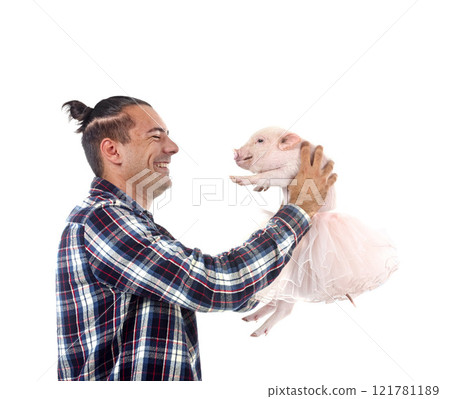 miniature pig and man in studio 121781189