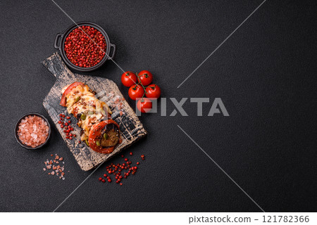 Rings of eggplant, tomato and zucchini with pieces of chicken and garlic Rings of eggplant, tomato and zucchini with pieces of chicken and garlic 121782366