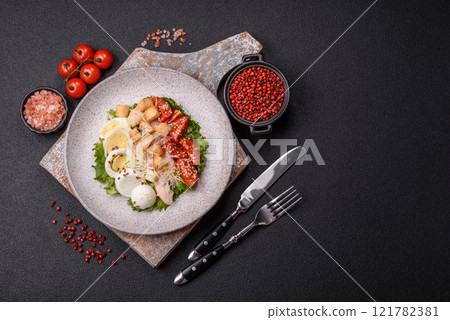 Delicious fresh salad with lettuce, croutons, chicken fillet, tomatoes and egg Delicious fresh salad with lettuce, croutons, chicken fillet, tomatoes and egg 121782381