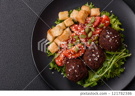 Hearty delicious fried falafel made from chickpeas, cumin, hummus with salt and spices Hearty delicious fried falafel made from chickpeas, cumin, hummus with salt and spices 121782386