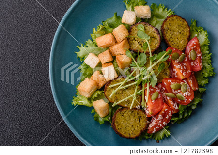 Hearty delicious fried falafel made from chickpeas, cumin, hummus with salt and spices Hearty delicious fried falafel made from chickpeas, cumin, hummus with salt and spices 121782398