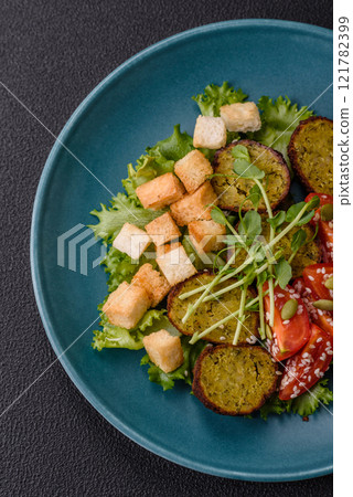 Hearty delicious fried falafel made from chickpeas, cumin, hummus with salt and spices Hearty delicious fried falafel made from chickpeas, cumin, hummus with salt and spices 121782399