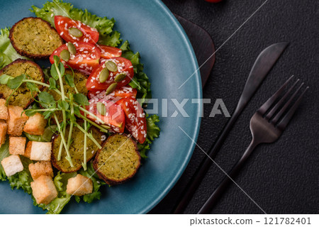 Hearty delicious fried falafel made from chickpeas, cumin, hummus with salt and spices Hearty delicious fried falafel made from chickpeas, cumin, hummus with salt and spices 121782401