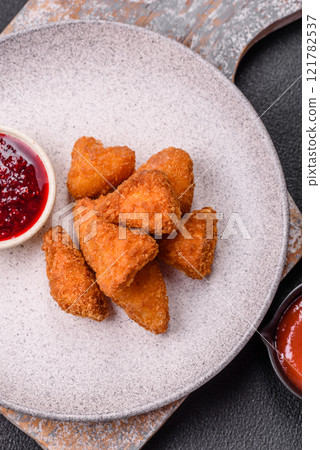 Brie cheese or camembert fries in breading, fast food, takeaway Brie cheese or camembert fries in breading, fast food, takeaway 121782537