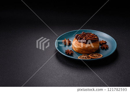 Sweet dessert danish covered with chocolate cream, with cream filling 121782593