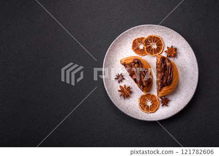 Sweet dessert danish covered with chocolate cream, with cream filling 121782606